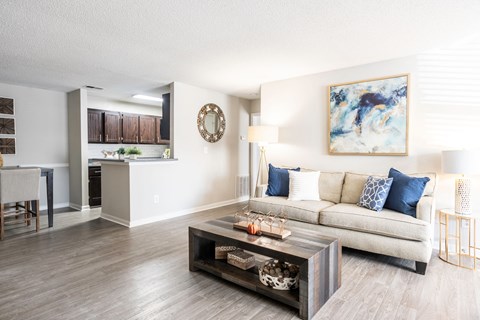 Large living room with LVT flooring located at Addison on Cobblestone located in Fayetteville, GA 30215